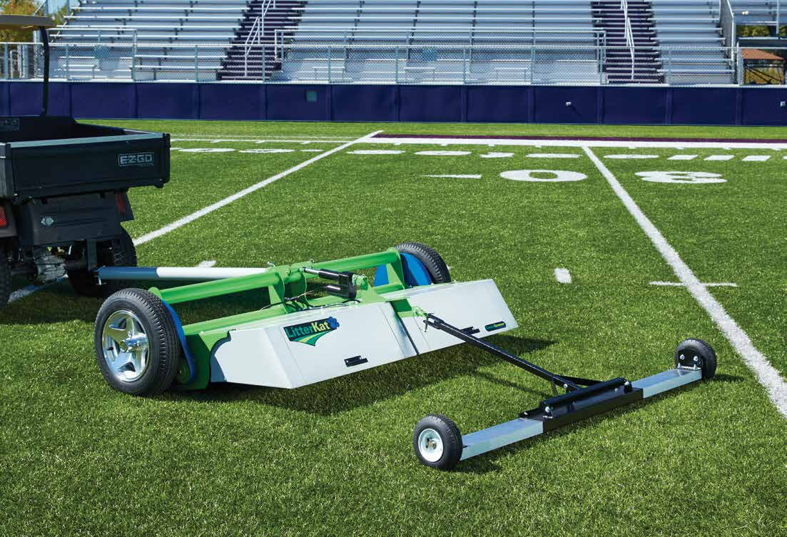 Turfgrass machine on field - Ball on green turf field - Act Sports, the Premium Artificial Sports Turf Supplier