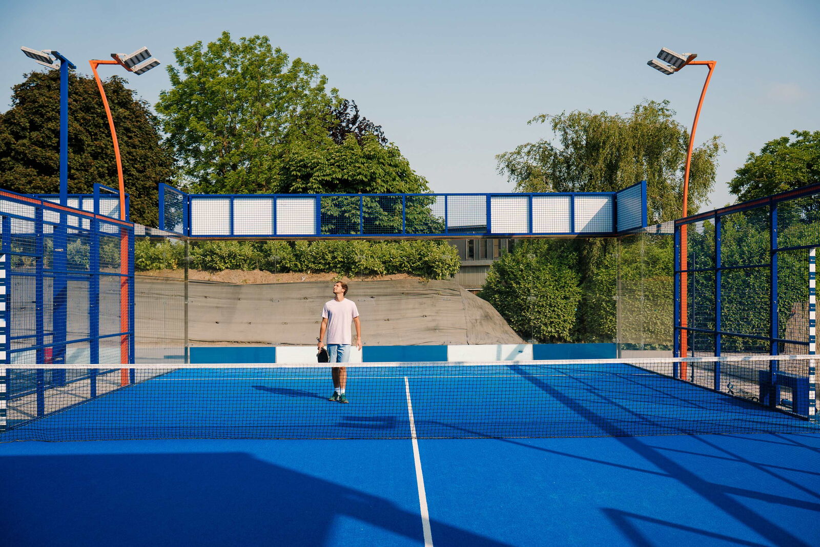 Blue padel field with padelplayer