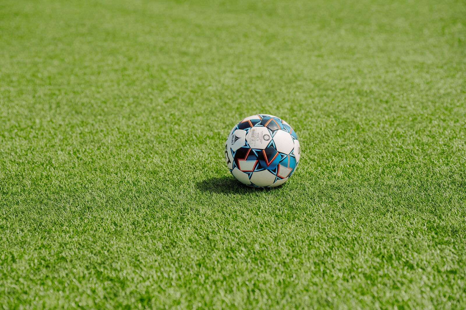 ball on green turf field
