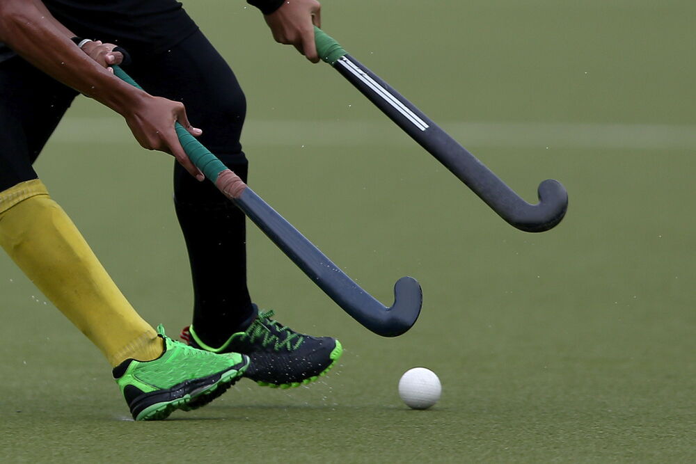 Hockey sticks on turfgrass playing