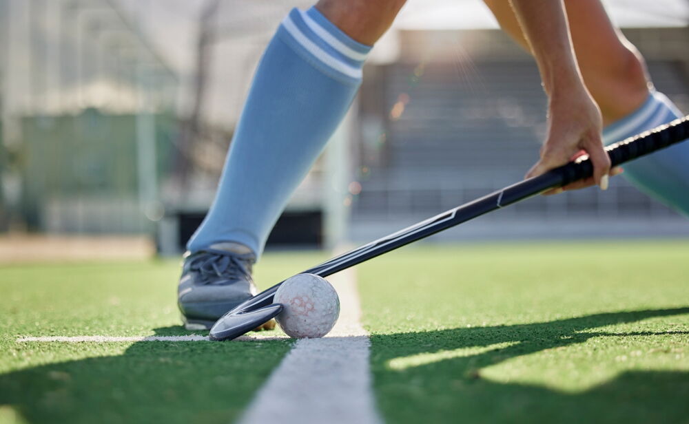 Hockeystick and player feet closeup