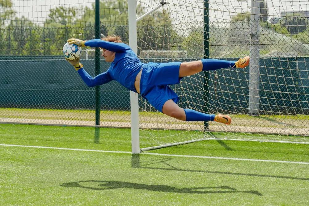 Goalie jumping mid air 